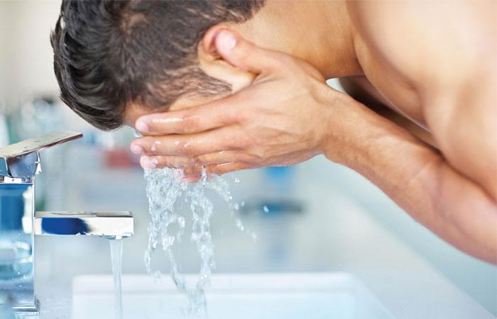 2018 Close-up of young man applying shaving cream